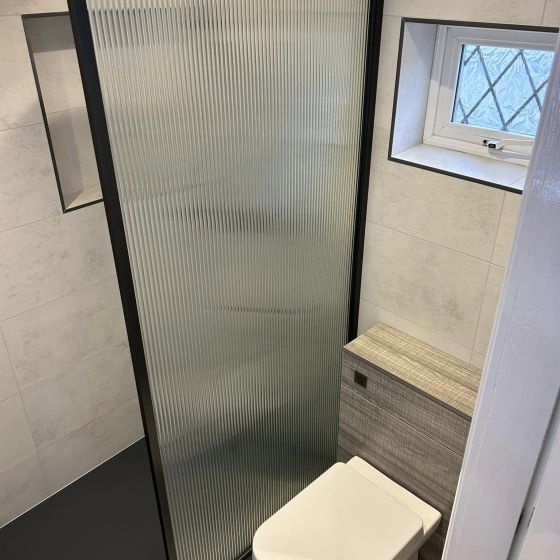 Amien Matt Black Framed Fluted Glass Shower Screen - 980mm