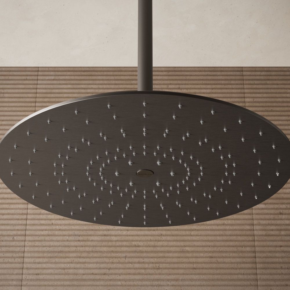 Aqualisa S3 gunmetal shower head on an brown tiled background