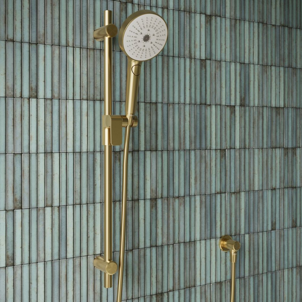 Aqualisa S3 Gold Slide Rail Kit detailed view upon a teal tiled background