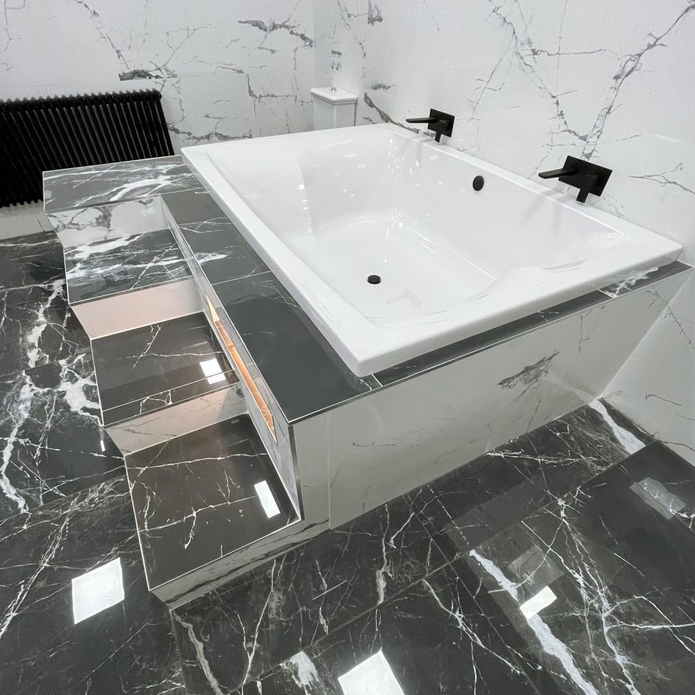 Contemporary bathroom setting showcasing the Carron Celsius Duo Double Ended Carronite Bath 2000x1400mm
