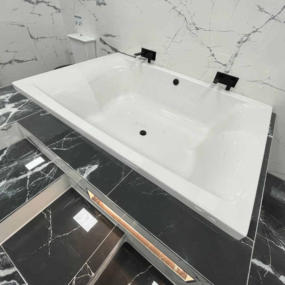Contemporary bathroom setting showcasing the Carron Celsius Duo Double Ended Carronite Bath 2000x1400mm