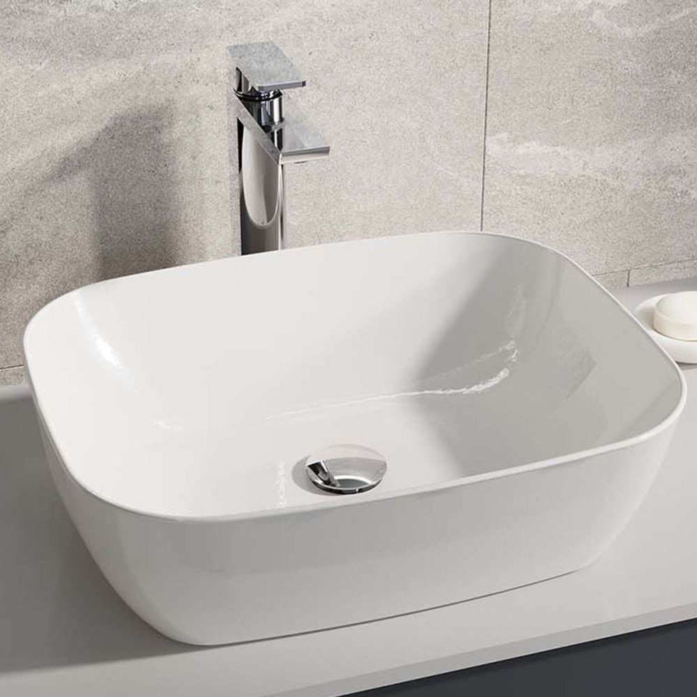 Lifestyle image showing the Zena Chrome Tall Basin Mixer Tap at the side of a countertop basin