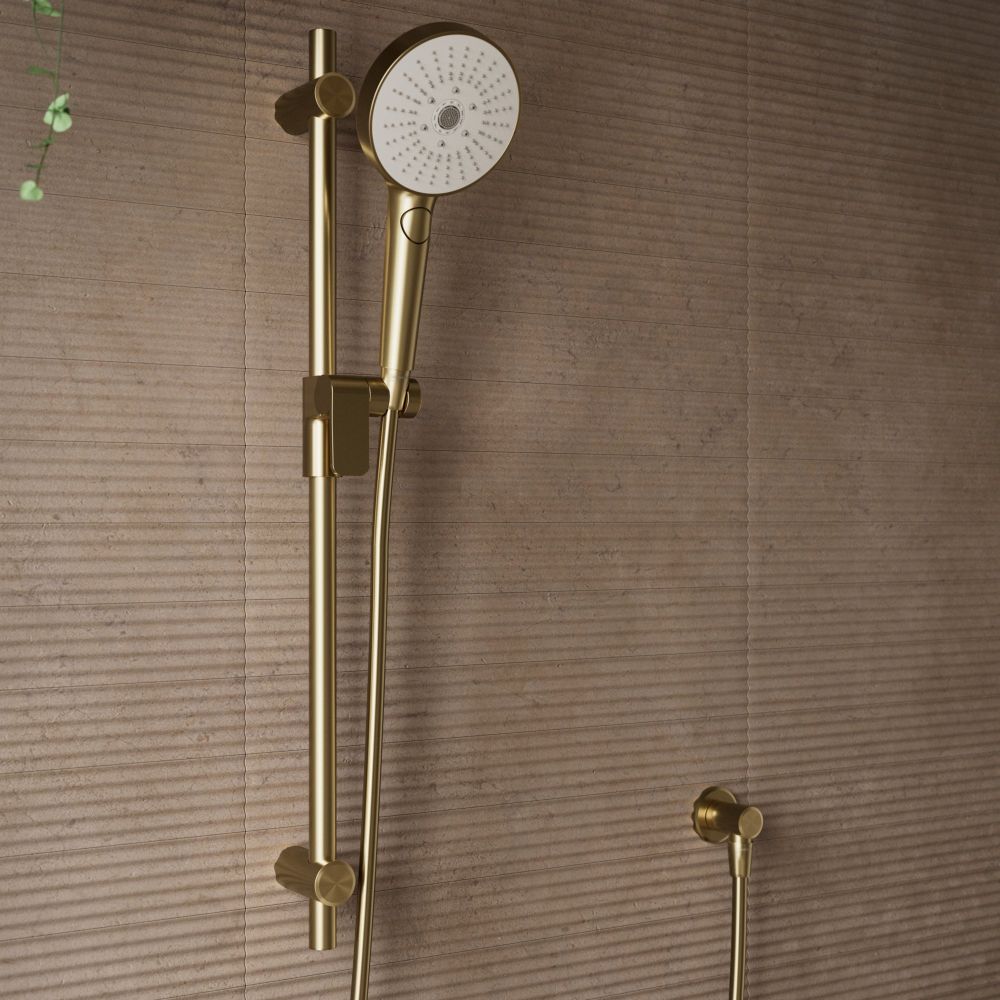 Aqualisa S3 Gold Slide Rail Kit detailed view upon a brown tiled background