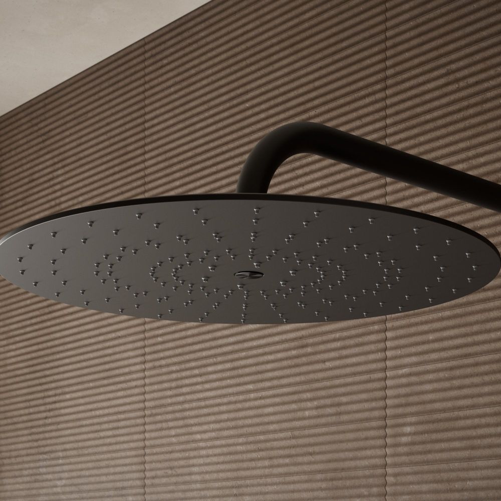 Aqualisa S3 black Wall Fixed Shower Head detailed view upon a brown tiled background