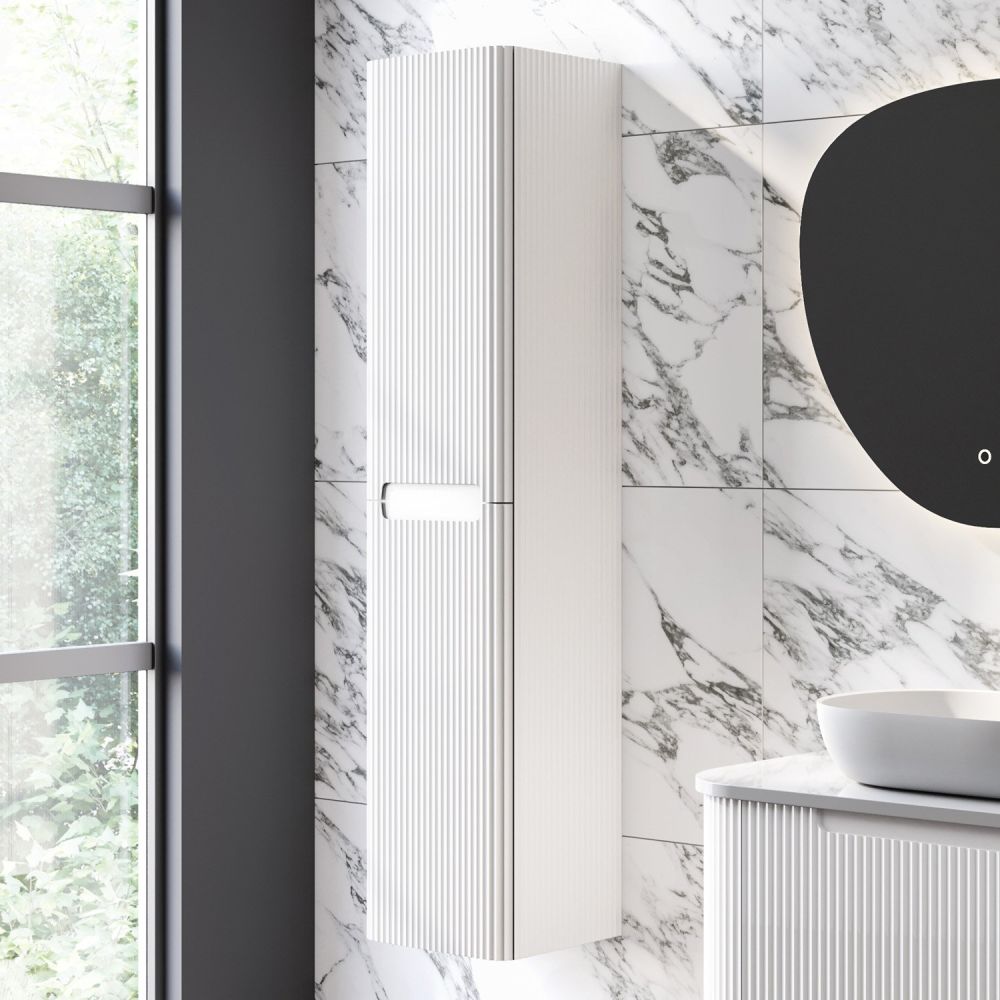 White marble roomset showcasing the Soar Ribbed White Wall Mounted Tall Storage Cabinet