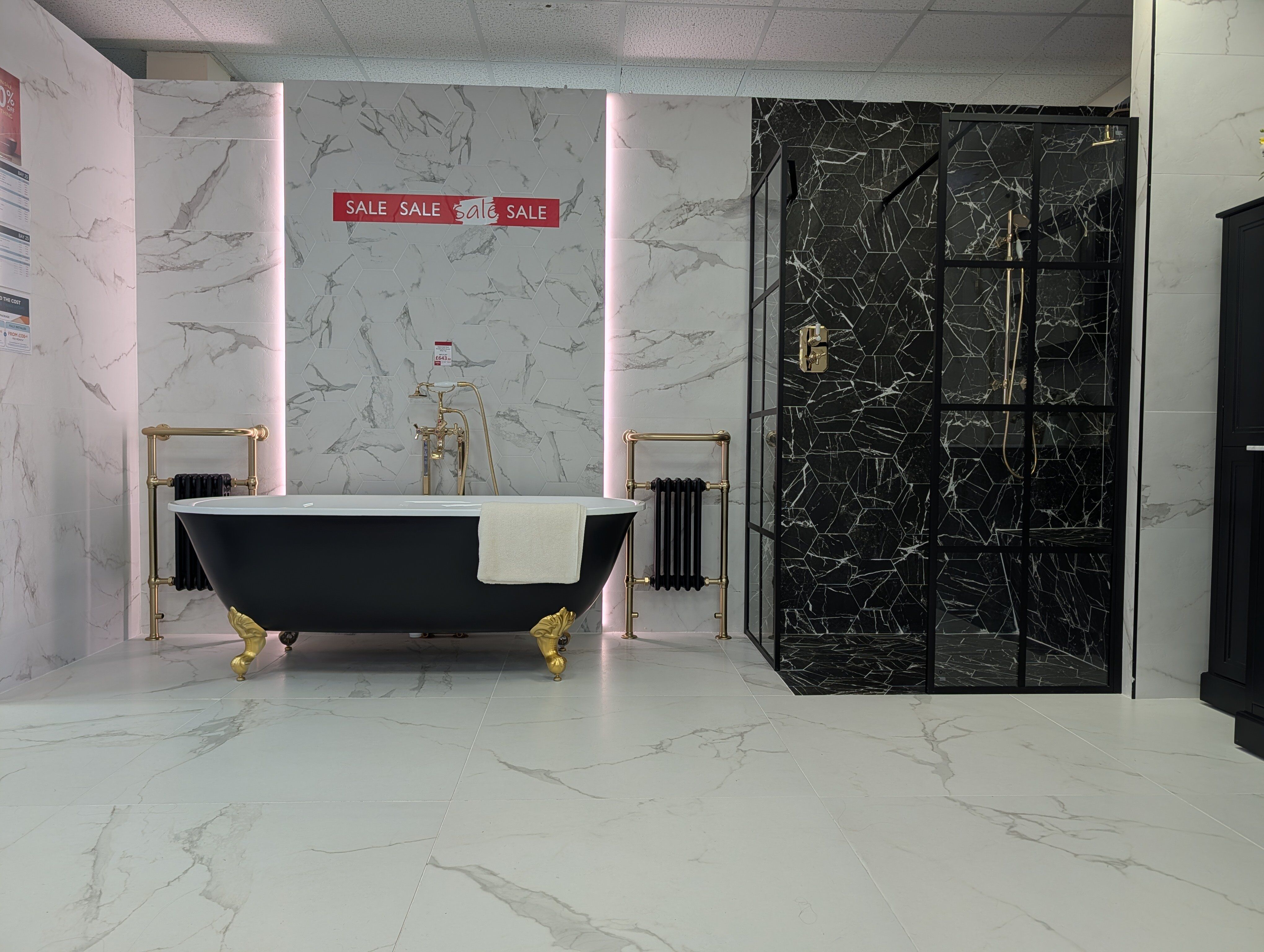 Fareham bathroom showroom display featuring bold black-and-white tiles with traditional styling.