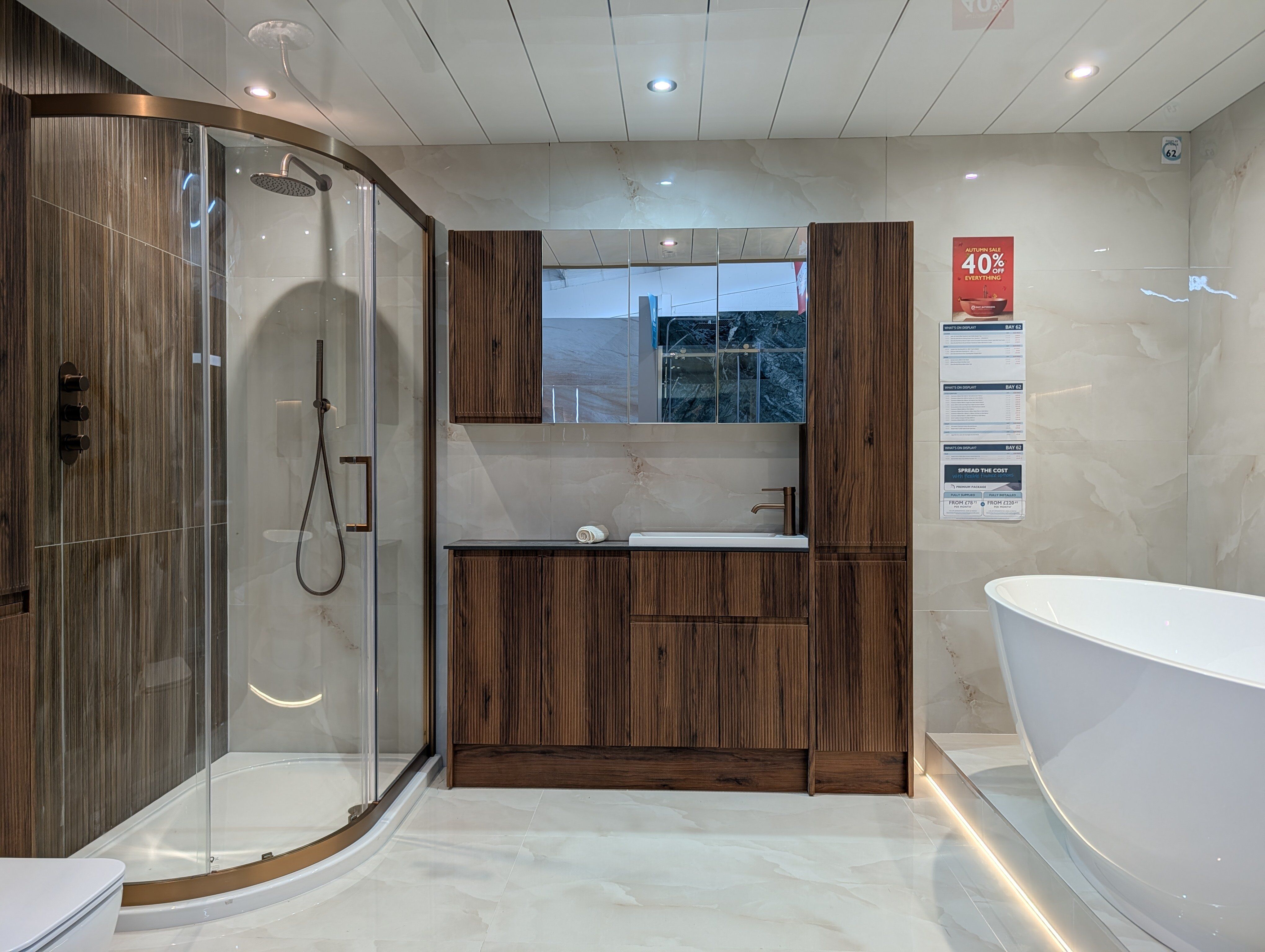 Modern bathroom display at Easy Bathrooms Portsmouth with warm wood and metal tones