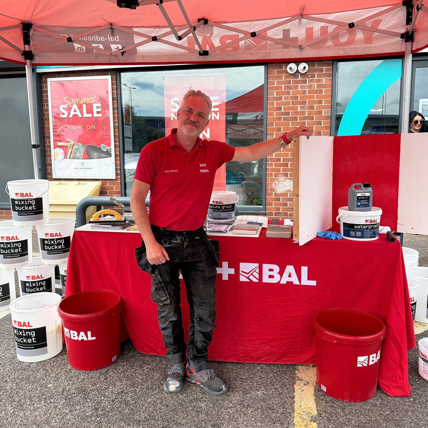 BAL representative demonstrating tiling and waterproofing products at the Easy Bathrooms Aintree trade day