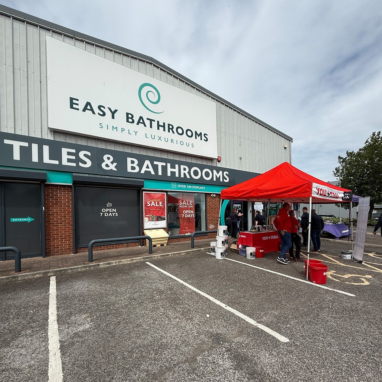 Easy Bathrooms Aintree showroom team standing together outside the store during the recent trade day