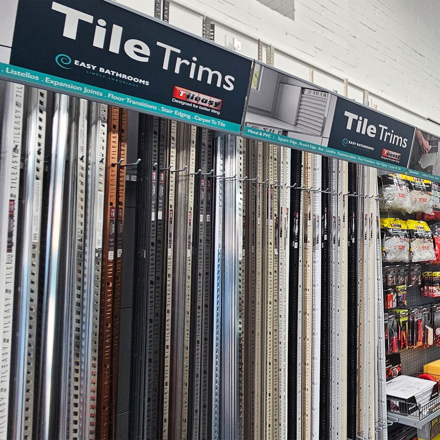 Tileasy tile trim display featuring a wide selection of metal and coloured trims for tiled walls, floors and edges.