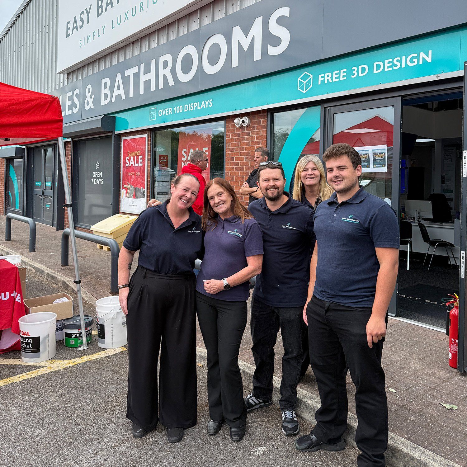Easy Bathrooms Aintree showroom hosting a trade day with supplier stands outside the bathroom and tile showroom.