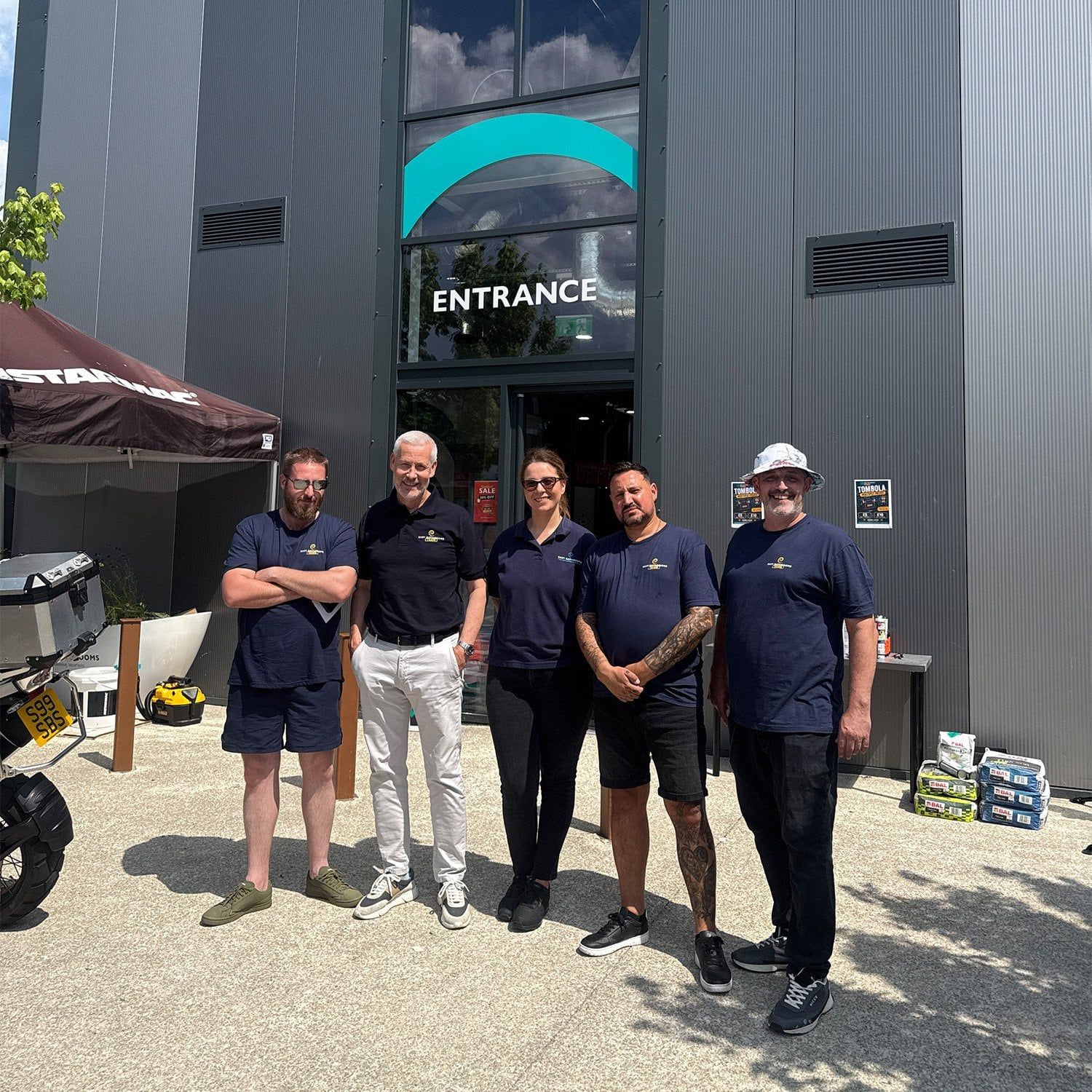 Easy Bathrooms Chesterfield team standing outside the showroom during the charity trade day.