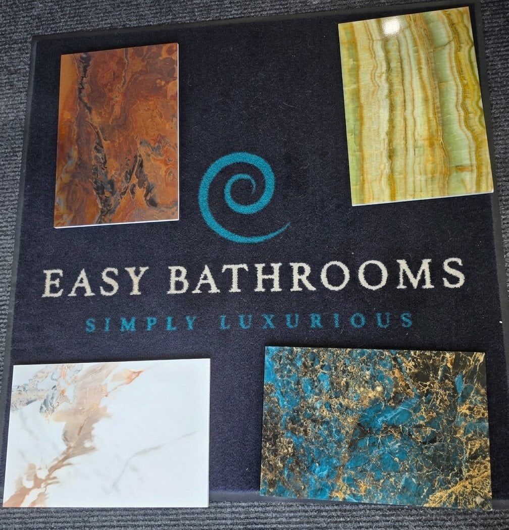 Pristina bathroom wall panel samples at Easy Bathrooms Chichester featuring a selection of marble, stone and statement designs.