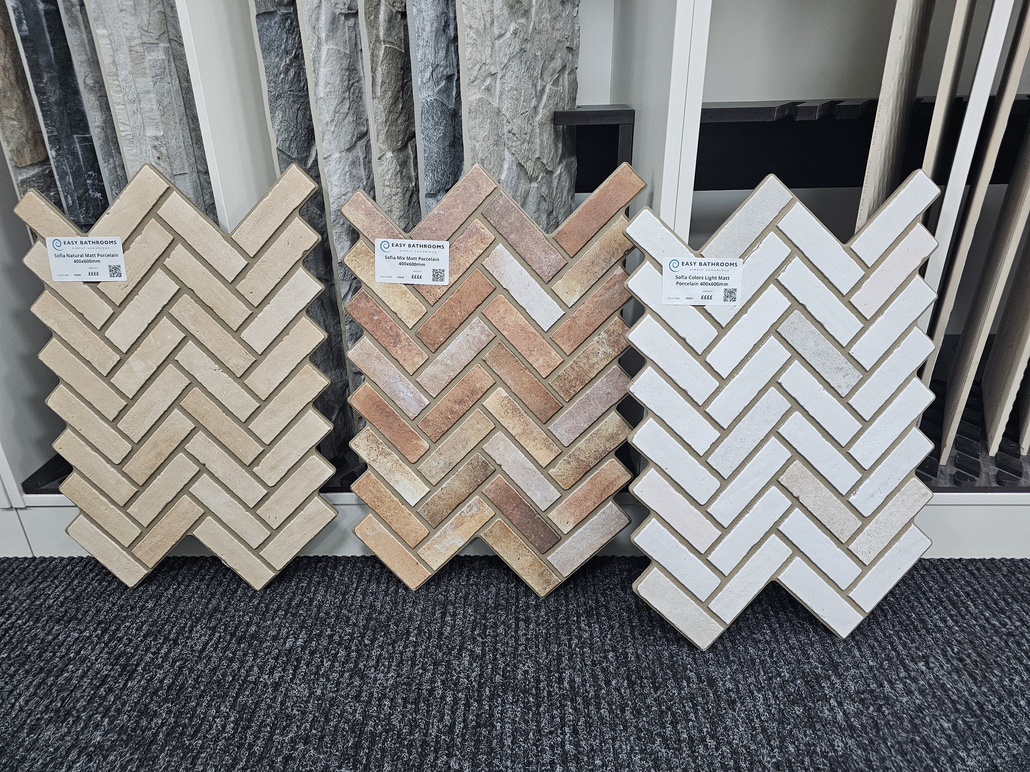 Chevron mosaic tile samples in a range of neutral and pastel colours.