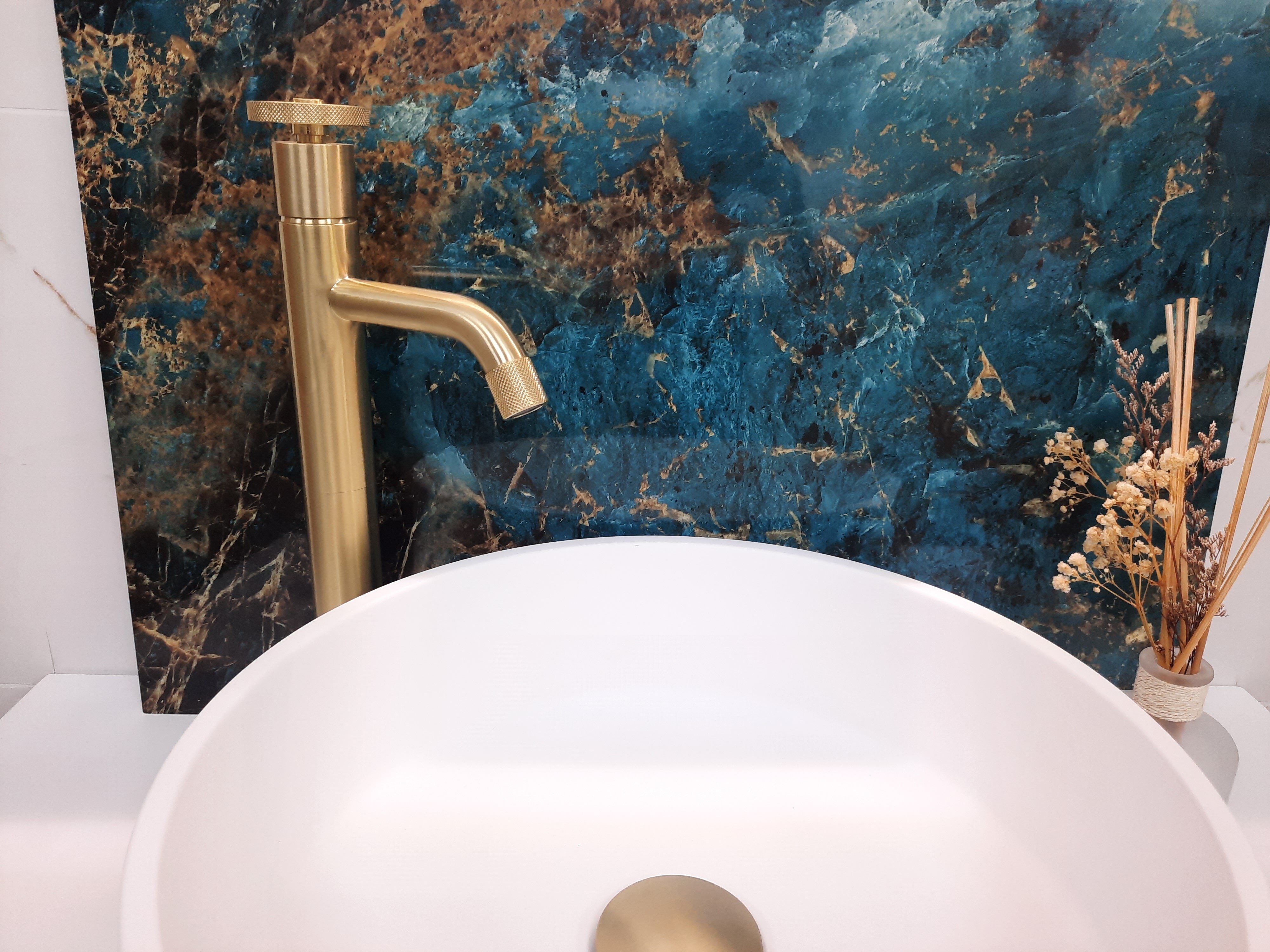 Blue and gold statement Pristina PVC wall panel displayed behind a freestanding bath.