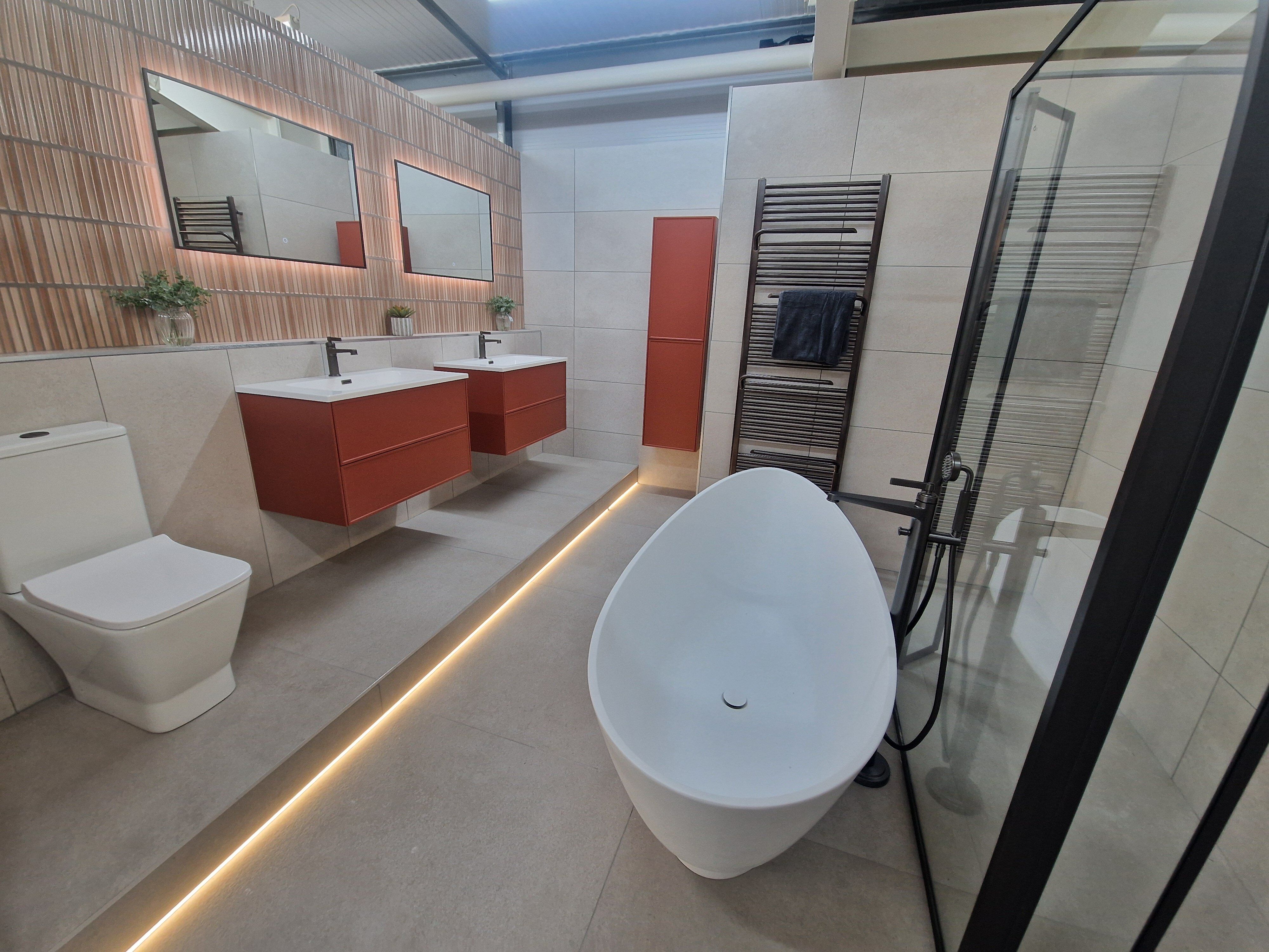 Bold pink bathroom choices in Easy Bathrooms Cirencester