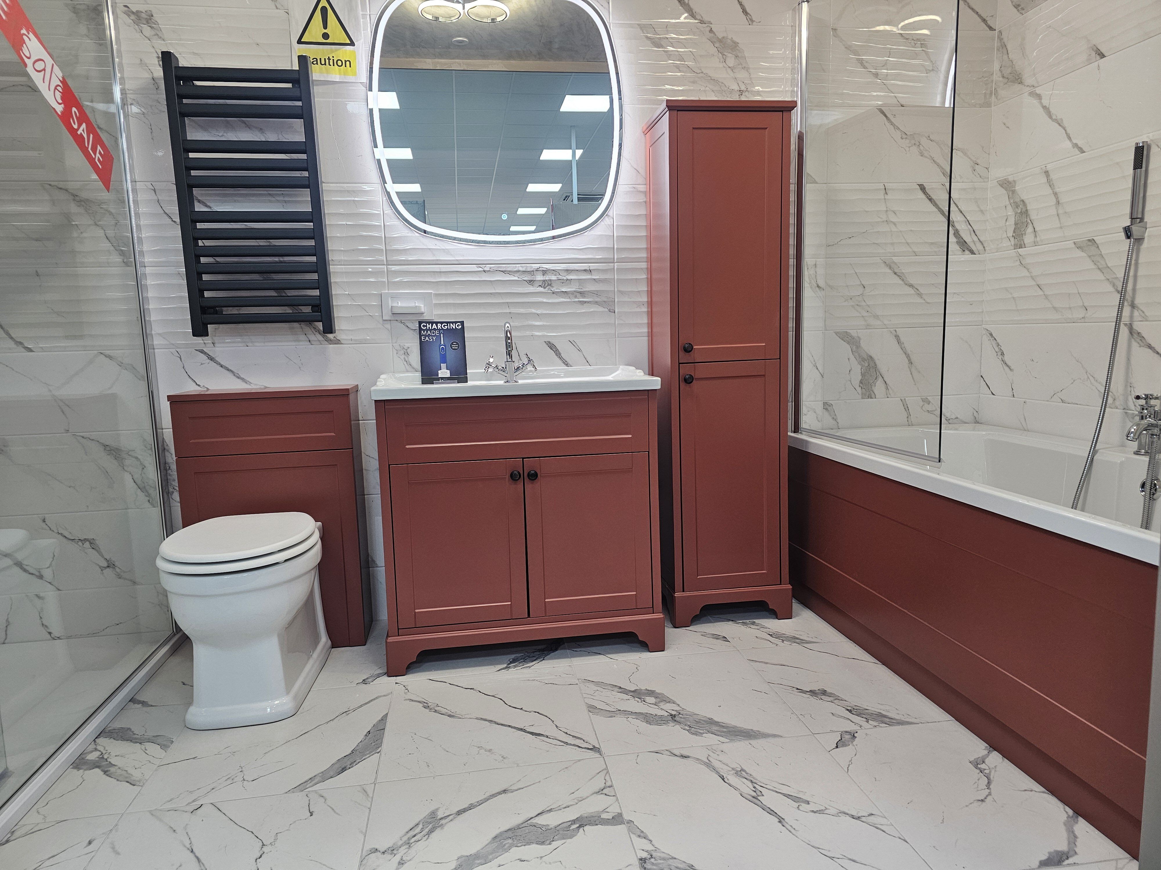 Showroom display featuring vibrant bathroom furniture and marble tiles