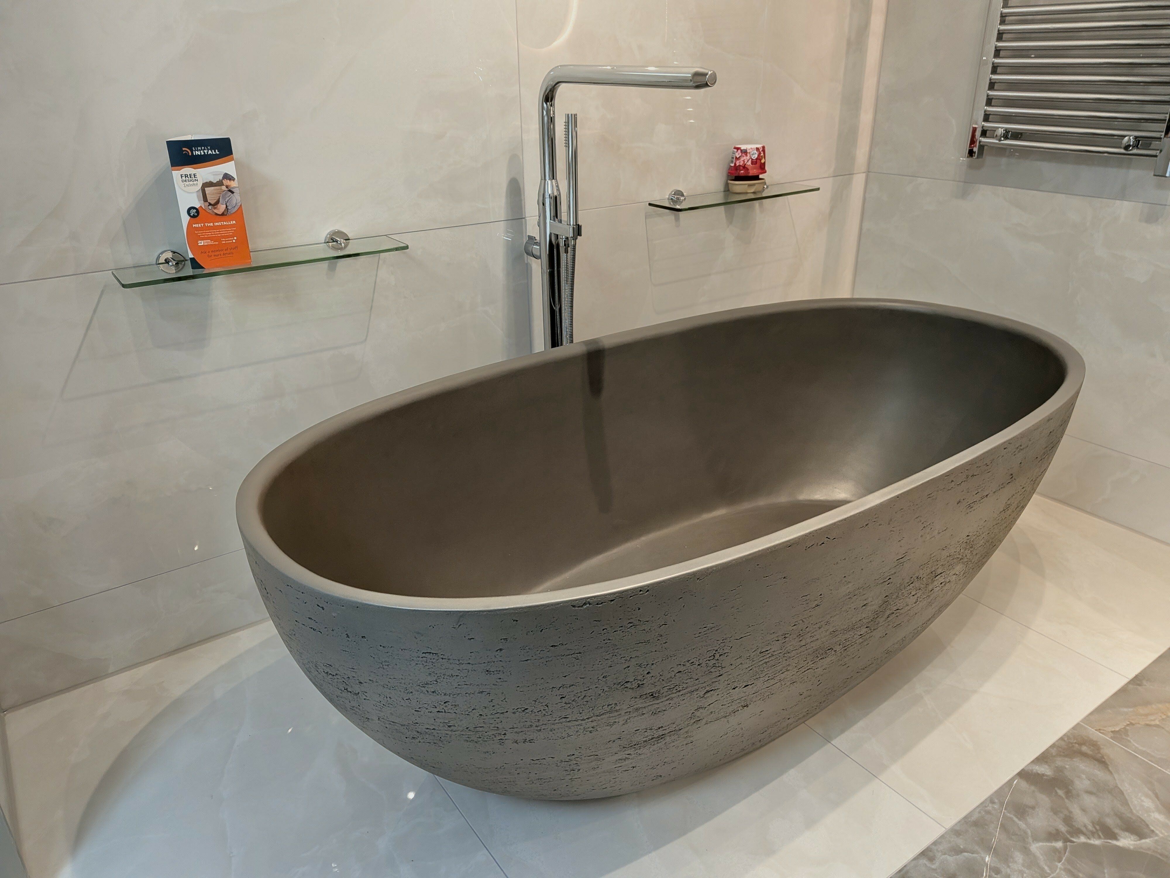 Brava concrete freestanding bath in dark grey at Easy Bathrooms Chichester