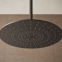 Aqualisa S3 gunmetal shower head on an brown tiled background