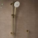 Aqualisa S3 Gold Slide Rail Kit detailed view upon a brown tiled background