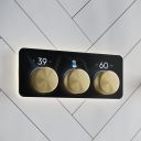 Aqualisa S3 Gold Horizontal Controls detailed view upon a white tiled background