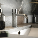 Moray Chrome single lever basin mixer tap featuring a textured knurled detailing - Roomset image