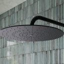 Aqualisa S3 black Wall Fixed Shower Head detailed view upon a teal tiled background