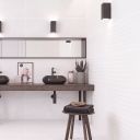 Modern spa-style bathroom with side wall tiled in Kenya Feel Blanco Wave 400x1200mm tiles and back wall in Kenya Axiom tiles.