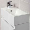 Close up view of the corner of the resin basin on the Compact Gloss White Wall Hung Cloakroom Vanity Unit