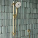 Aqualisa S3 Gold Slide Rail Kit detailed view upon a teal tiled background