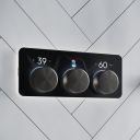 Aqualisa S3 Gunmetal Controls kon an white tiled background