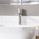 Lifestyle image in a neutral cool bathroom showing the Pancho Chrome Tall Basin Mixer Tap