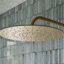 Aqualisa S3 Gold Wall Fixed Shower Head detailed view upon a teal tiled background