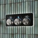 Aqualisa S3 Gunmetal Controls kon an aqua tiled background