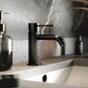 Moray Gunmetal single lever basin mixer tap featuring a textured knurled detailing - Roomset