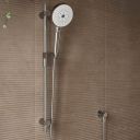 Aqualisa S3 Chrome Slide Rail Kit detailed view upon a brown tiled background