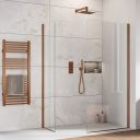 Oxford Brushed Bronze Walk-In Wetroom Shower Screen with clear glass panels and bronze trim profile in a modern marble effect tiled bathroom.