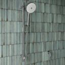 Aqualisa S3 chrome Slide Rail Kit detailed view upon a teal tiled background