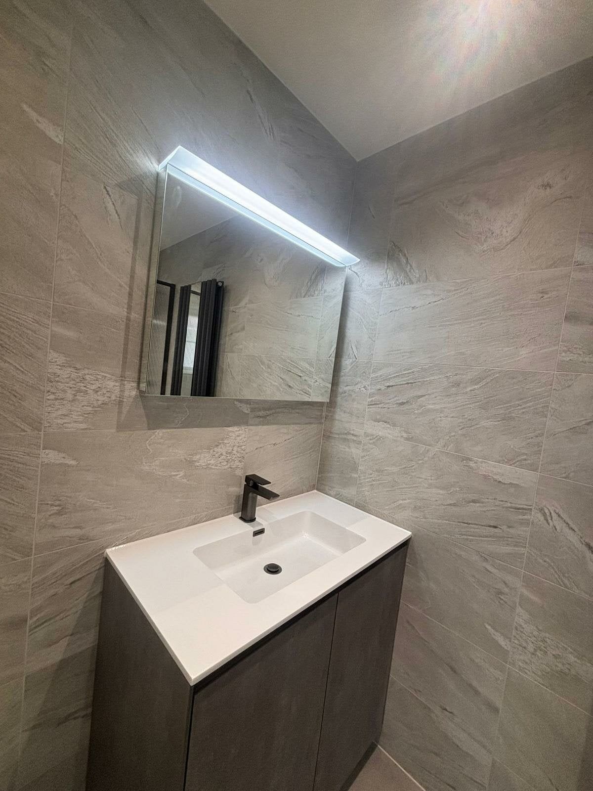 Basin, mirror and vanity unit from Easy Bathrooms & Tiles Bedford