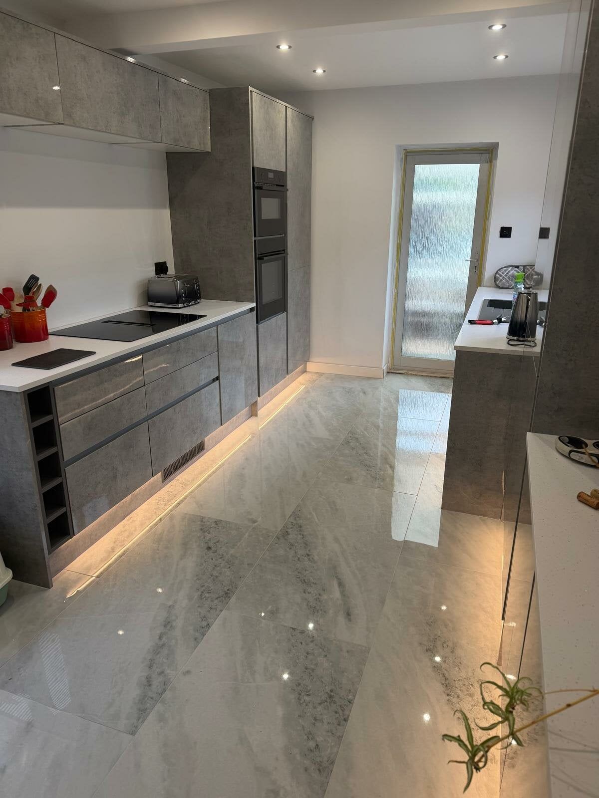 White gloss rise crystal tiles featured in a customers kitchen from Easy Bathrooms