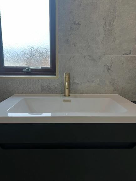 Vanity unit in black with modern basin top