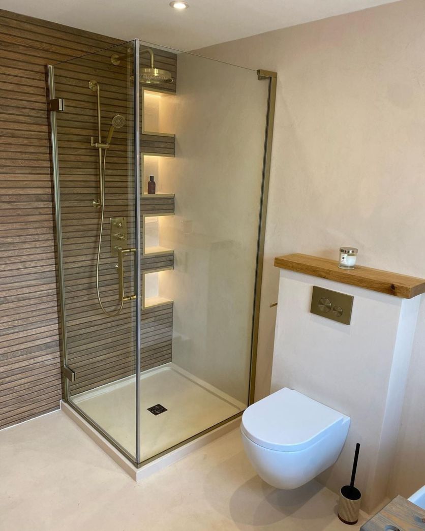 Madera slatted wood tiles beside a Lanka brushed gold shower and concealed valve in a Scandi-style bathroom.