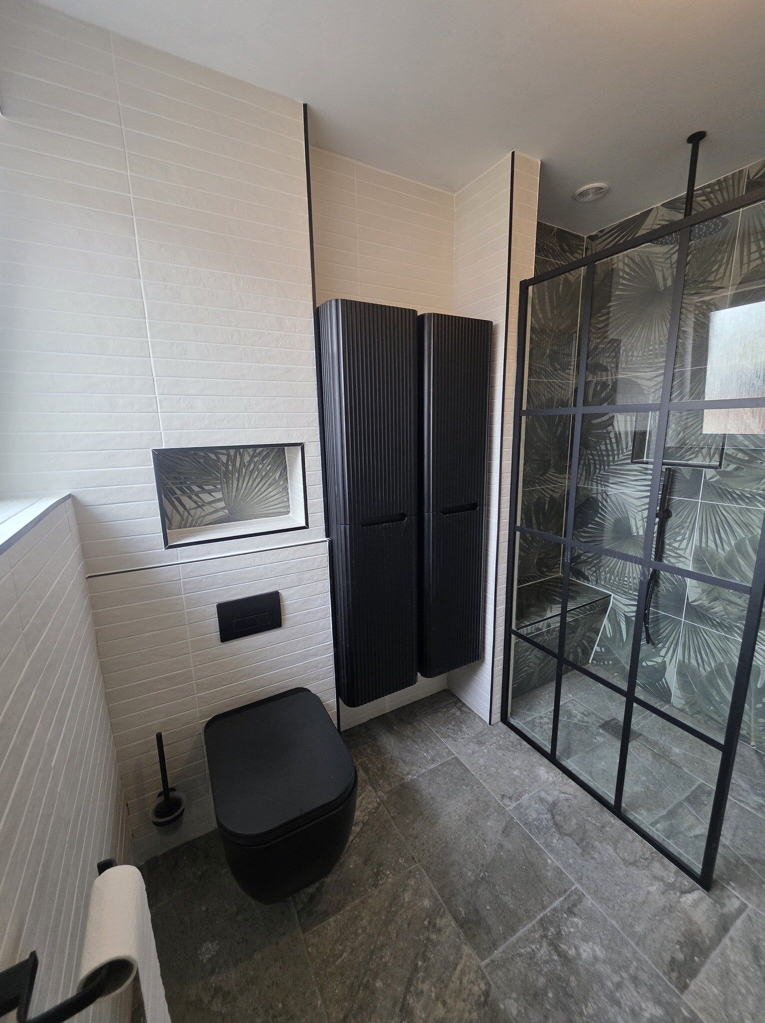 Accessible bathroom supplied by Easy Bathrooms Lincoln with walk-in shower, wall-hung storage and contemporary finishes.