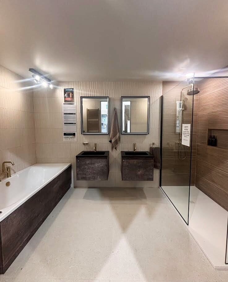 Bathroom overview with spa like theme -ambient and accent lighting / walk-in shower / niche / wood effect tiles / neutral stone effect ribbed walls