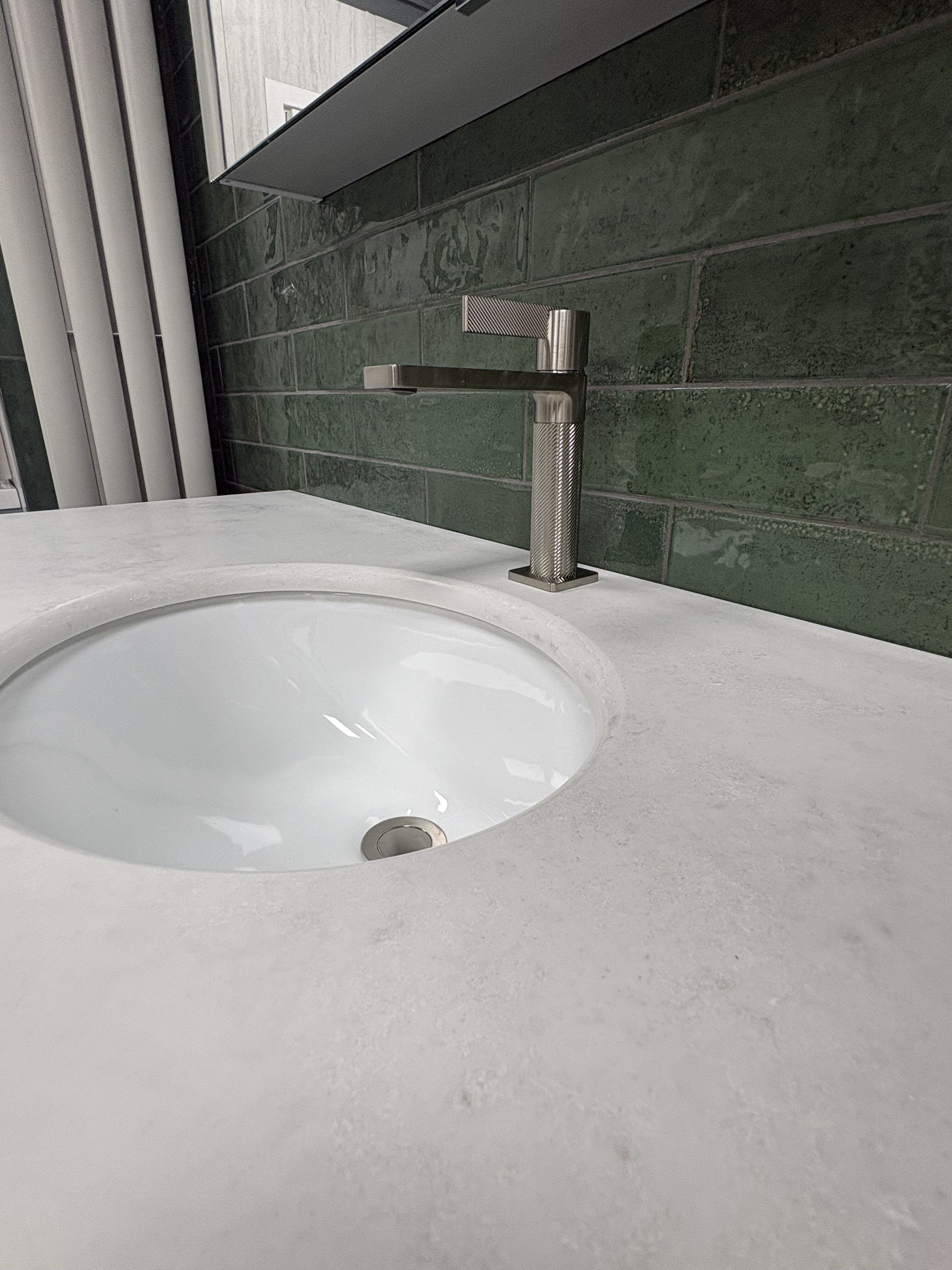 Thane Textured Basin Tap in Brushed Nickel with an undermount ceramic basin and quartz worktop.