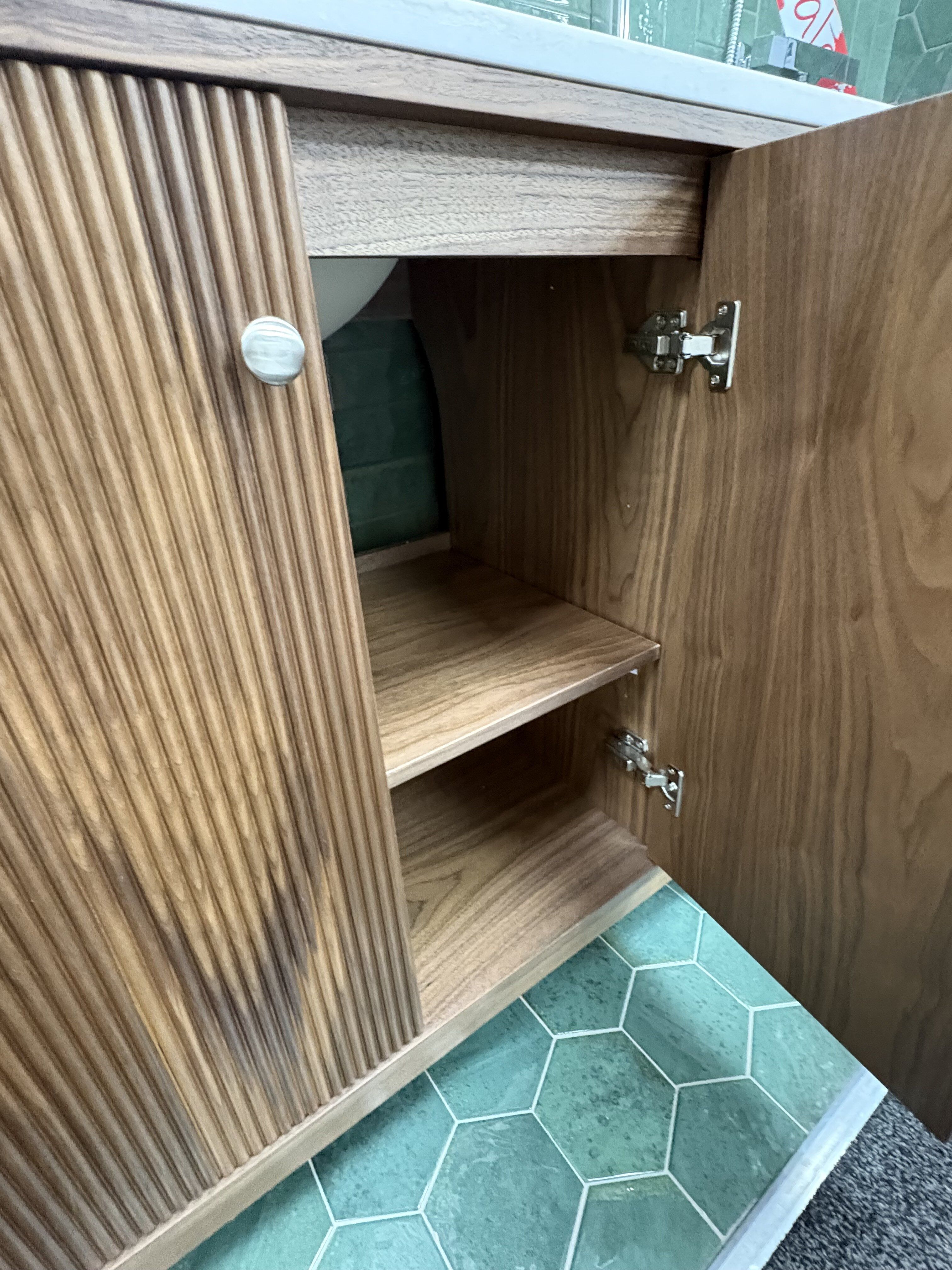 Open storage cupboard in the Hayward Natural Walnut bathroom vanity unit.