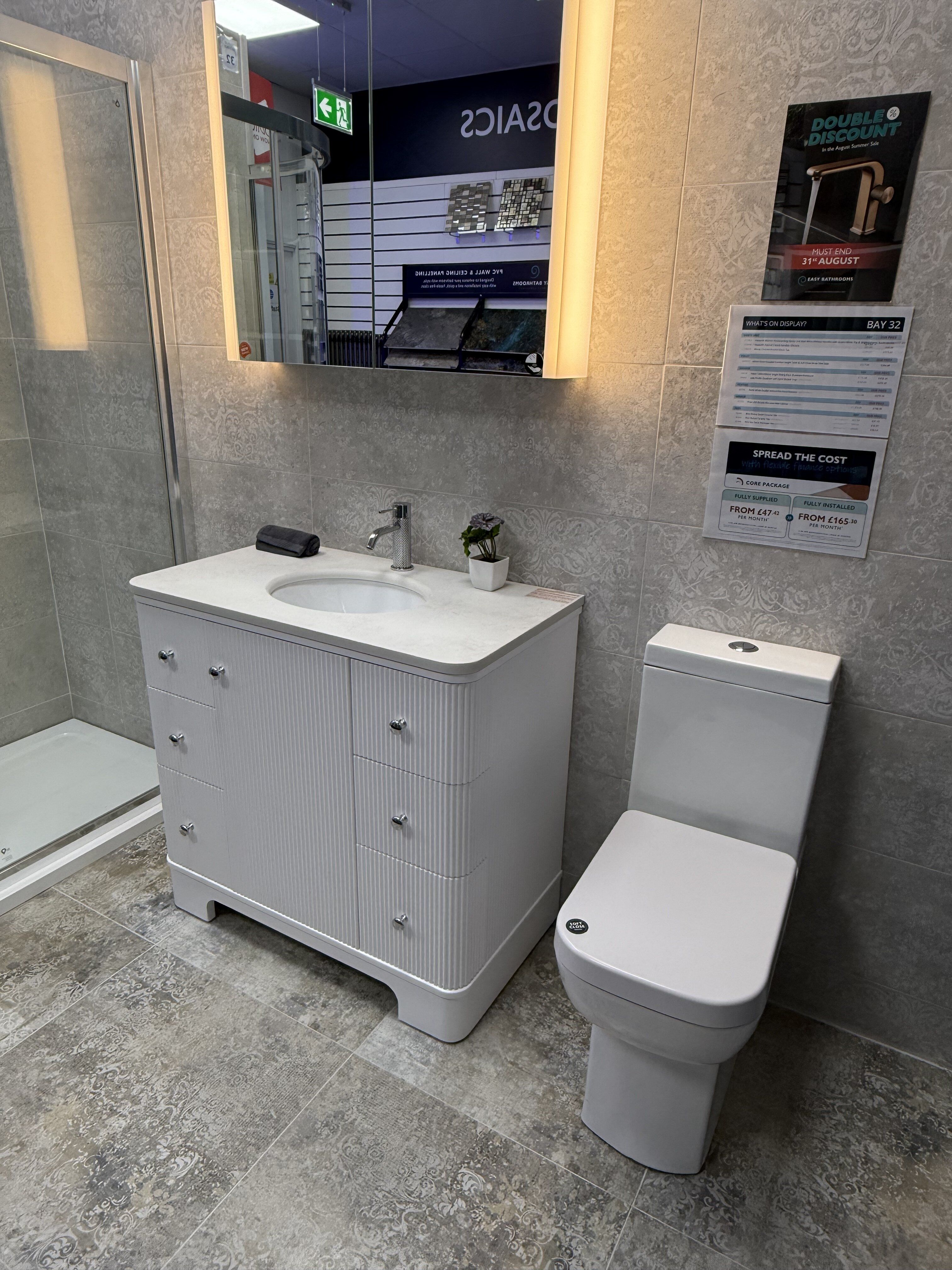 Hayward Matt White 900mm floorstanding vanity unit on display at Easy Bathrooms Romford with white basin and chrome tap.