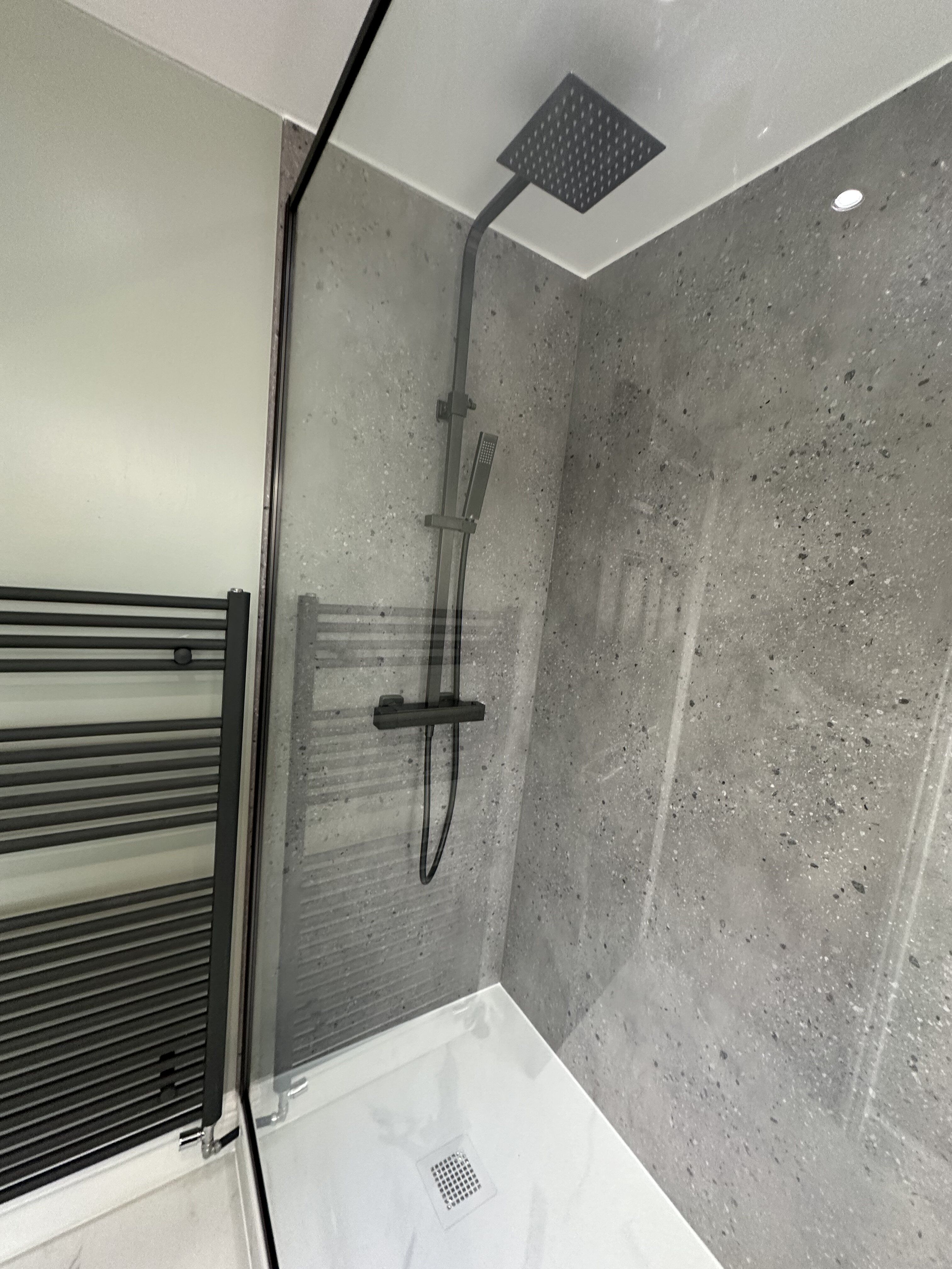 Modern walk in shower with sage green painted walls