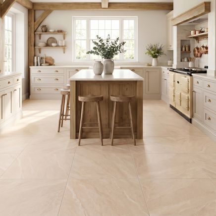 Beige porcelain tile in country style kitchen with wood accents and cream kitchen cupboards