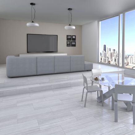 Open-plan living room floor tiled in Espada Ice Matt Porcelain Tiles 300x600mm.